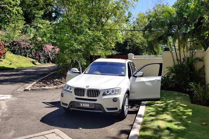 Private Round Trip Airport (UVF) Transfer: Luxury SUV - Inside the luxury SUV: air-conditioning plus snacks and local drinks