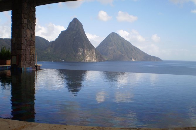 The Pitons rising over the water on St Lucia&rsquo;s west coast